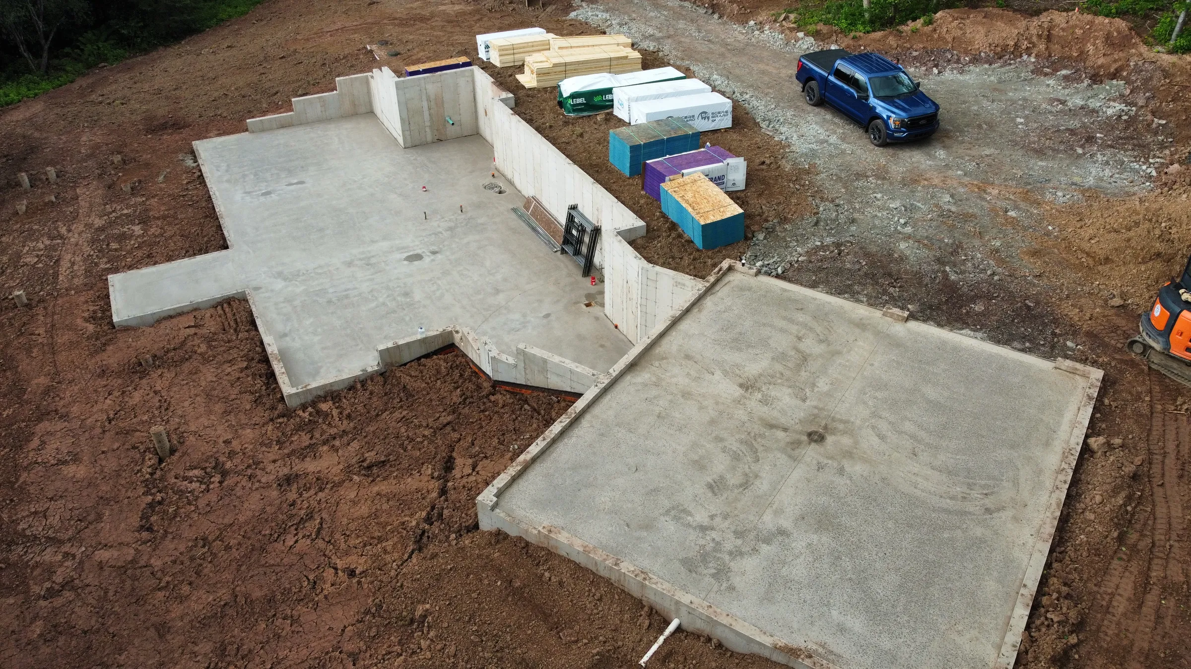 A homes foundation poured and the site cleaned up