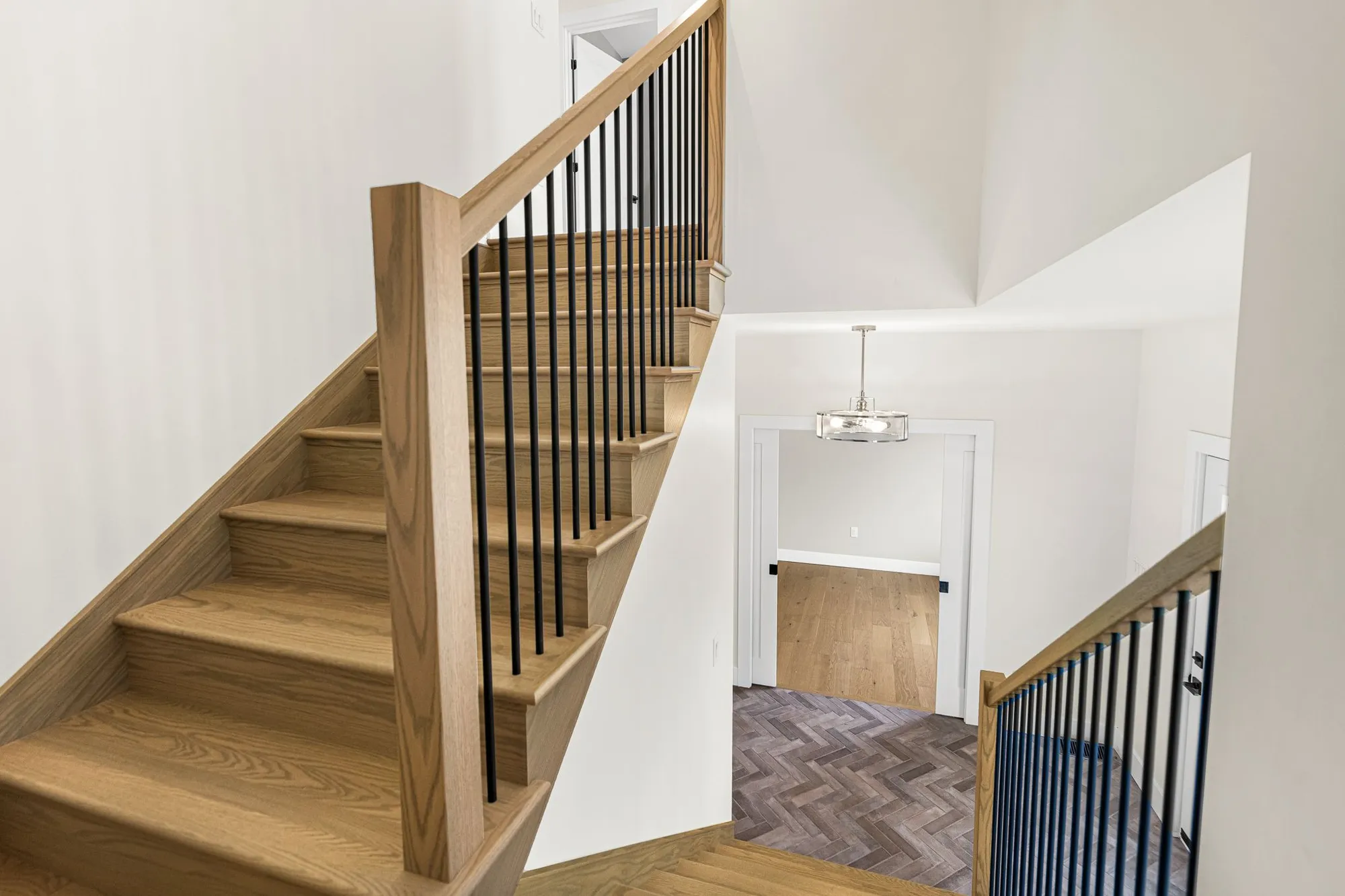 Black shiplap fireplace with custom mantel to match hardwood.
