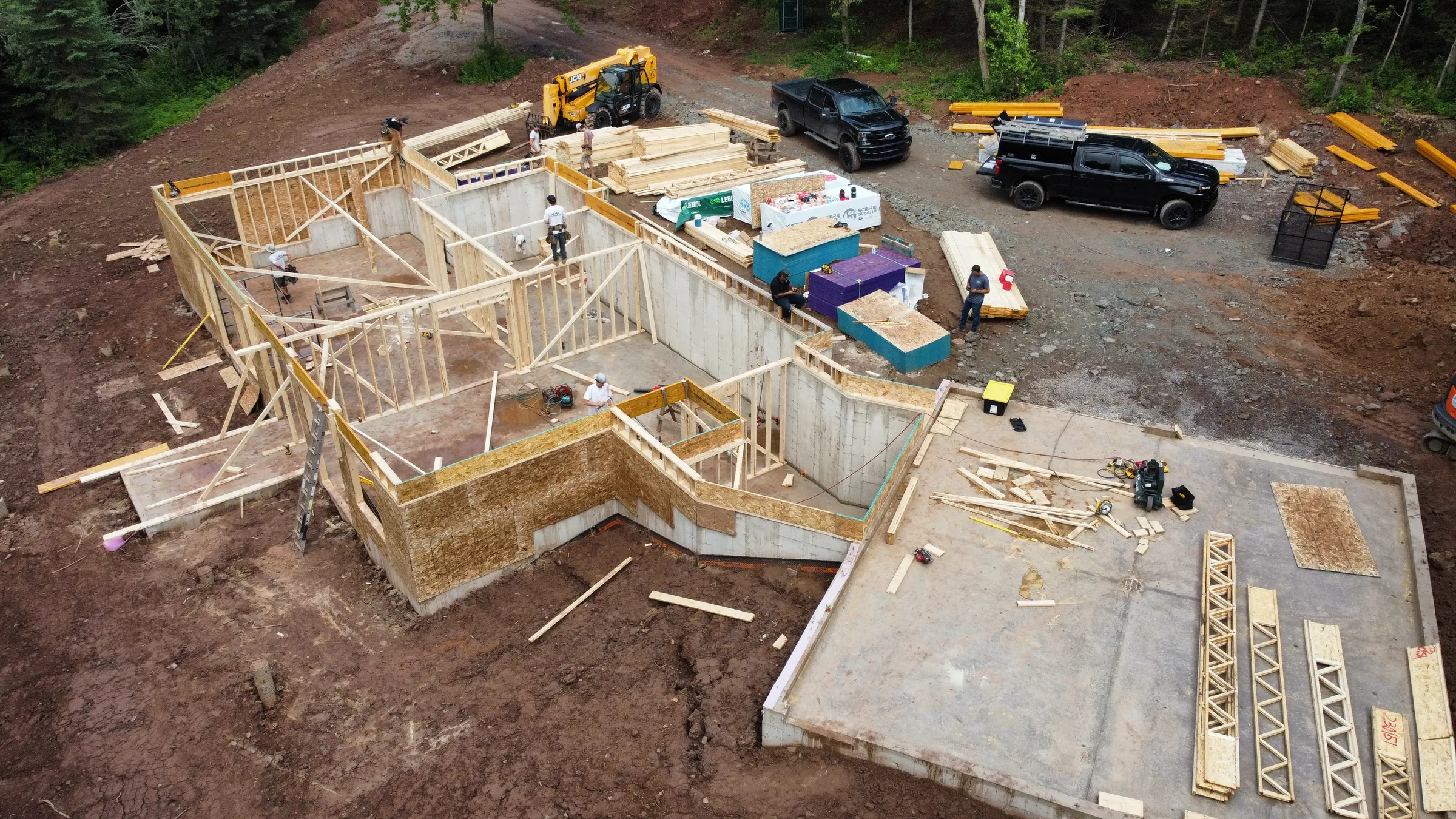 A home framing being done right after the foundation was poured